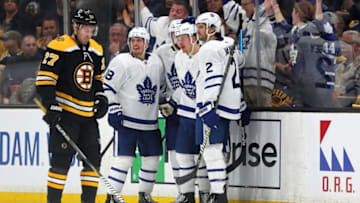 Andreas Johnsson #18 of the Toronto Maple Leafs and Ron Hainsey #2 celebrate with Kasperi Kapanen #24 of the Toronto Maple Leafs after he scored a goal as John Moore #27 of the Boston Bruins looks on during the third period of Game Five of the Eastern Conference First Round during the 2019 NHL Stanley Cup Playoffs at TD Garden. (Photo by Maddie Meyer/Getty Images)