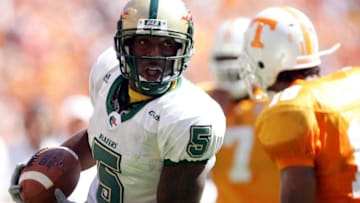 KNOXVILLE, TN - SEPTEMBER 3: Jhun Cook #5 of UAB carries the ball as Jason Allen #18 of Tennessee closes in on September 3, 2005 at Neyland Stadium in Knoxville, Tennessee. The Volunteers defeated UAB 17-10. (Photo by Elsa/Getty Images)