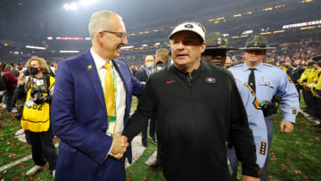 INDIANAPOLIS, INDIANA - JANUARY 10: Head Coach Kirby Smart of the Georgia Bulldogs shakes hands with SEC Commissioner Greg Sankey after the Georgia Bulldogs defeated the Alabama Crimson Tide 33-18 in the 2022 CFP National Championship Game at Lucas Oil Stadium on January 10, 2022 in Indianapolis, Indiana. (Photo by Kevin C. Cox/Getty Images)