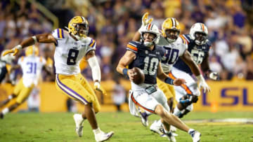 Auburn football quarterback Bo Nix scrambles as The LSU Tigers take on the Auburn Tigers in Tiger Stadium. Saturday, Oct. 2, 2021.