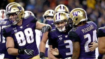 SEATTLE, WA - NOVEMBER 03: Jake Browning #3 of the Washington Huskies celebrates with Kamari Pleasant #24 of the Washington Huskies after rushing for a two yard touchdown against the Stanford Cardinal in the first quarter during their game at Husky Stadium on November 3, 2018 in Seattle, Washington. (Photo by Abbie Parr/Getty Images)