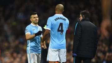 MANCHESTER, ENGLAND - MARCH 15: An injured Vincent Kompany of Manchester City (4) hands the captains armband to Sergio Aguero of Manchester City as he leaves the pitch during the UEFA Champions League round of 16 second leg match between Manchester City FC and FC Dynamo Kyiv at the Etihad Stadium on March 15, 2016 in Manchester, United Kingdom. (Photo by Laurence Griffiths/Getty Images)