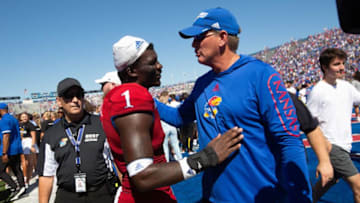 Kansas coach Lance Leipold congratulates senior safety Kenny Logan Jr.