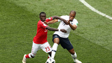 MOSCOW, RUSSIA - JUNE 26: Djibril Sidibe of France is tackled by Pione Sisto of Denmark during the 2018 FIFA World Cup Russia group C match between Denmark and France at Luzhniki Stadium on June 26, 2018 in Moscow, Russia. (Photo by Ryan Pierse/Getty Images)