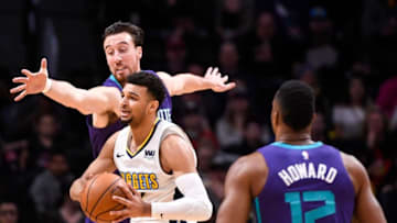 DENVER, CO - FEBRUARY 05: Jamal Murray #27 of the Denver Nuggets looks for an open teammate past Frank Kaminsky #44 of the Charlotte Hornets at the Pepsi Center on February 5, 2018 in Denver, Colorado. NOTE TO USER: User expressly acknowledges and agrees that, by downloading and or using this photograph, User is consenting to the terms and conditions of the Getty Images License Agreement. (Photo by Timothy Nwachukwu/Getty Images)
