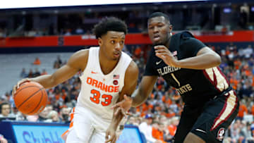 SYRACUSE, NY - FEBRUARY 05: Elijah Hughes #33 of the Syracuse Orange drives to the basket against the defense of Raiquan Gray #1 of the Florida State Seminoles during the first half at the Carrier Dome on February 5, 2019 in Syracuse, New York. (Photo by Rich Barnes/Getty Images)