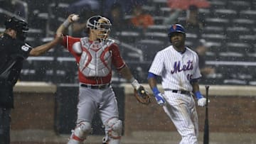 Jul 9, 2016; New York City, NY, USA; New York Mets left fielder Alejandro De Aza (16) reacts after a called strike by umpire Jim Joyce (66) in the ninth inning against the Washington Nationals at Citi Field. The Nationals won 6-1. Mandatory Credit: Noah K. Murray-USA TODAY Sports