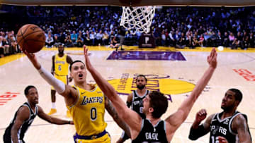 LOS ANGELES, CA - OCTOBER 22: Kyle Kuzma #0 of the Los Angeles Lakers scores on a layup past Pau Gasol #16 of the San Antonio Spurs during a 143-142 Laker loss at Staples Center on October 22, 2018 in Los Angeles, California. (Photo by Harry How/Getty Images)