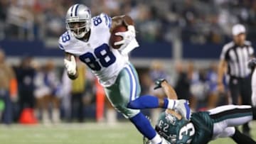 Dec 29, 2013; Arlington, TX, USA; Dallas Cowboys receiver Dez Bryant (88) runs after a reception for a fourth quarter touchdown against Philadelphia Eagles safety Patrick Chung (23) at AT&T Stadium. The Eagle beat the Cowboys 24-22. Mandatory Credit: Matthew Emmons-USA TODAY Sports