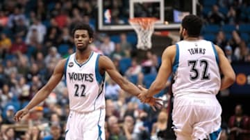 Apr 3, 2016; Minneapolis, MN, USA; Minnesota Timberwolves forward Andrew Wiggins (22) high fives center Karl-Anthony Towns (32) in the third quarter against the Dallas Mavericks at Target Center. The Dallas Mavericks beat the Minnesota Timberwolves 88-78. Mandatory Credit: Brad Rempel-USA TODAY Sports