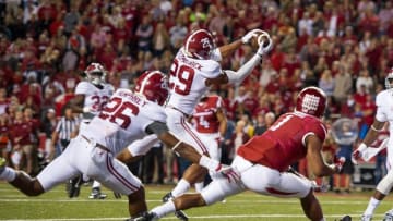 Oct 8, 2016; Fayetteville, AR, USA; Alabama Crimson Tide defensive back Minkah Fitzpatrick (29) intercepts the ball intended for Arkansas Razorbacks wide receiver Jared Cornelius (1) during the fourth quarter at Donald W. Reynolds Razorback Stadium. Mandatory Credit: Brett Rojo-USA TODAY Sports