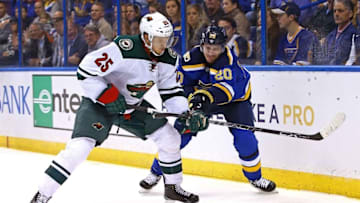 Oct 13, 2016; St. Louis, MO, USA; Minnesota Wild defenseman Jonas Brodin (25) is checked off the puck by St. Louis Blues left wing Alexander Steen (20) during the second period at Scottrade Center. Mandatory Credit: Billy Hurst-USA TODAY Sports