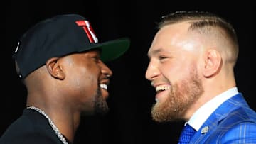 TORONTO, ON - JULY 12: Floyd Mayweather Jr. and Conor McGregor faceoff during the Floyd Mayweather Jr. v Conor McGregor World Press Tour at Budweiser Stage on July 12, 2017 in Toronto, Canada. (Photo by Vaughn Ridley/Getty Images)