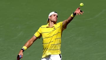 KEY BISCAYNE, FL - APRIL 01: John Isner serves to Alexander Zverev of German during the men's final of the Miami Open Presented by Itau at Crandon Park Tennis Center on April 1, 2018 in Key Biscayne, Florida. (Photo by Matthew Stockman/Getty Images)