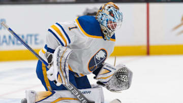 Feb 18, 2023; San Jose, California, USA; Buffalo Sabres goaltender Ukko-Pekka Luukkonen (1) blocks the puck with his stick during the second period against the San Jose Sharks at SAP Center at San Jose. Mandatory Credit: Stan Szeto-USA TODAY Sports