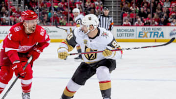 DETROIT, MI - MARCH 08: Tomas Tatar #90 of the Vegas Golden Knights skates up ice next to Luke Glendening #41 of the Detroit Red Wings during an NHL game at Little Caesars Arena on March 8, 2018 in Detroit, Michigan. The Golden Knights defeated the Wings 4-0. (Photo by Dave Reginek/NHLI via Getty Images)
