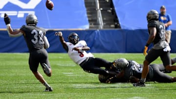 PITTSBURGH, PA - SEPTEMBER 26: Malik Cunningham #3 of the Louisville Cardinals throws an interception as he is hit by Calijah Kancey #8 of the Pittsburgh Panthers in the fourth quarter during the game at Heinz Field on September 26, 2020 in Pittsburgh, Pennsylvania. (Photo by Justin Berl/Getty Images)