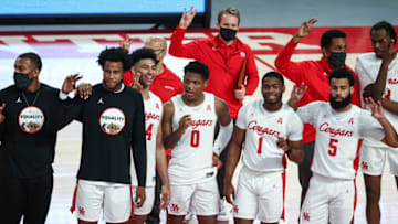 Jan 31, 2021; Houston, Texas, USA; Houston Cougars guard Marcus Sasser (0) celebrates with teammates after defeating the Southern Methodist Mustangs at Fertitta Center. Mandatory Credit: Troy Taormina-USA TODAY Sports
