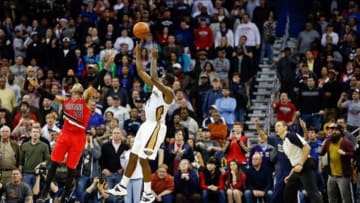Dec 30, 2013; New Orleans, LA, USA; New Orleans Pelicans point guard Tyreke Evans (1) makes a shot over Portland Trail Blazers point guard Mo Williams (25) with 1.2 seconds remaining in the fourth quarter of a game at the New Orleans Arena. The Pelicans defeated the Trail Blazers 110-108. Mandatory Credit: Derick E. Hingle-USA TODAY Sports