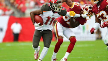 TAMPA, FLORIDA - NOVEMBER 11: DeSean Jackson #11 of the Tampa Bay Buccaneers stiff-arms Greg Stroman #37 of the Washington Redskins during the third quarter at Raymond James Stadium on November 11, 2018 in Tampa, Florida. (Photo by Will Vragovic/Getty Images)