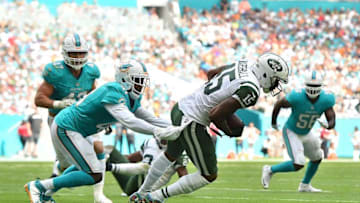 Nov 6, 2016; Miami Gardens, FL, USA; Miami Dolphins cornerback Byron Maxwell (41) tackles New York Jets wide receiver Brandon Marshall (15) during the first half at Hard Rock Stadium. Mandatory Credit: Jasen Vinlove-USA TODAY Sports