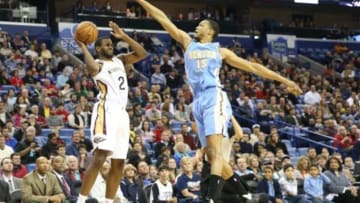 Dec 27, 2013; New Orleans, LA, USA; New Orleans Pelicans small forward Darius Miller (2) is defended by Denver Nuggets small forward Anthony Randolph (15) in the first quarter at New Orleans Arena. Mandatory Credit: Crystal LoGiudice-USA TODAY Sports