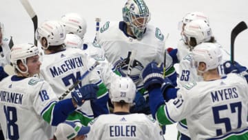 Mar 17, 2021; Ottawa, Ontario, CAN; The Vancouver Canucks celebrate their win against the Ottawa Senators in a shootout at the Canadian Tire Centre. Mandatory Credit: Marc DesRosiers-USA TODAY Sports