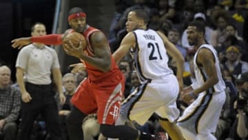 Dec 26, 2014; Memphis, TN, USA; Houston Rockets forward Josh Smith (5) spins around Memphis Grizzlies forward Tayshaun Prince (21) during the game at FedExForum. Mandatory Credit: Justin Ford-USA TODAY Sports