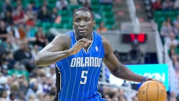 Mar 22, 2014; Salt Lake City, UT, USA; Orlando Magic guard Victor Oladipo (5) dribbles the ball during the first half against the Utah Jazz at EnergySolutions Arena. Mandatory Credit: Russ Isabella-USA TODAY Sports