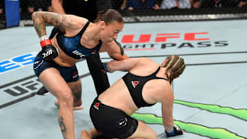 SACRAMENTO, CALIFORNIA - JULY 13: (L-R) Germaine de Randamie of the Netherlands punches Aspen Ladd in their women's bantamweight bout during the UFC Fight Night event at Golden 1 Center on July 13, 2019 in Sacramento, California. (Photo by Jeff Bottari/Zuffa LLC/Zuffa LLC via Getty Images)