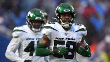 Dec 29, 2019; Orchard Park, New York, USA; New York Jets outside linebacker James Burgess (58) jogs off the field after his interception against the Buffalo Bills during the second quarter at New Era Field. Mandatory Credit: Rich Barnes-USA TODAY Sports