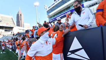 Oct 17, 2020; Atlanta, GA, USA; Clemson head coach Dabo Swinney celebrates with fans after Clemson won 73-7 during an NCAA college football game at Bobby Dodd Stadium. Mandatory Credit: Hyosub Shin/Pool Photo-USA TODAY Sports