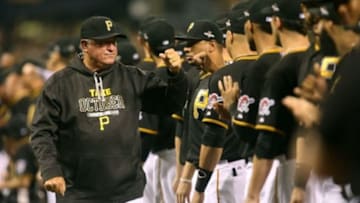 Oct 7, 2015; Pittsburgh, PA, USA; Pittsburgh Pirates manager Clint Hurdle (left) high fives his team during introductions prior to the National League Wild Card playoff baseball game against the Chicago Cubs at PNC Park. Mandatory Credit: Charles LeClaire-USA TODAY Sports
