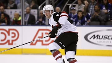 Dec 15, 2016; Toronto, Ontario, CAN; Arizona Coyotes forward Peter Holland (13) skates against the Toronto Maple Leafs during the first period at Air Canada Centre. Mandatory Credit: John E. Sokolowski-USA TODAY Sports