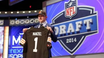 May 8, 2014; New York, NY, USA; Johnny Manziel (Texas A&M) poses with a jersey after being selected as the number twenty-two overall pick in the first round of the 2014 NFL Draft to the Cleveland Browns at Radio City Music Hall. Mandatory Credit: Adam Hunger-USA TODAY Sports