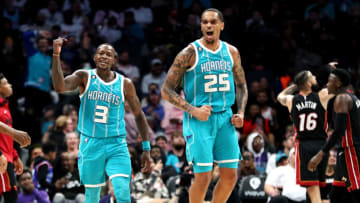 Terry Rozier #3 and P.J. Washington #25 of the Charlotte Hornets celebrate at the end of the third quarter(Photo by David Jensen/Getty Images)