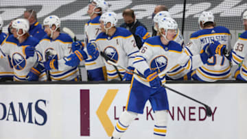 BOSTON, MA - APRIL 13: Rasmus Dahlin #26 of the Buffalo Sabres reacts after scoring a goal in the third period of against the Boston Bruins at TD Garden on April 13, 2021 in Boston, Massachusetts. (Photo by Adam Glanzman/Getty Images)