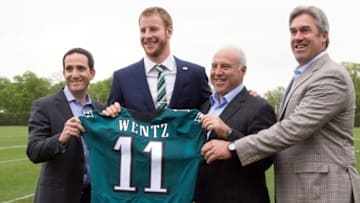 Apr 29, 2016; Philadelphia, PA, USA; From right to left Philadelphia Eagles head coach Doug Pederson and owner Jeffrey Lurie and quarterback Carson Wentz and vice president of football operations Howie Roseman pose for a photo as Wentz is introduced to the media at NovaCare Complex Auditorium. Mandatory Credit: Bill Streicher-USA TODAY Sports