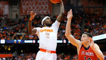 SYRACUSE, NY - DECEMBER 06: B.J. Johnson #2 of the Syracuse Orange takes a shot over Amar Alibegovic #14 of the St. John's Red Storm during the first half of the game at the Carrier Dome on December 6, 2014 in Syracuse, New York. (Photo by Rich Barnes/Getty Images)