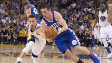 March 27, 2016; Oakland, CA, USA; Golden State Warriors guard Stephen Curry (30) reaches for the basketball against Philadelphia 76ers guard T.J. McConnell (12) during the third quarter at Oracle Arena. The Warriors defeated the 76ers 117-105. Mandatory Credit: Kyle Terada-USA TODAY Sports