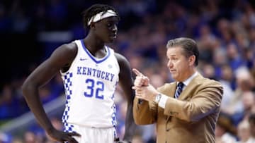 LEXINGTON, KY - NOVEMBER 22: John Calipari the head coach of the Kentucky Wildcats gives instructions to Wenyen Gabriel