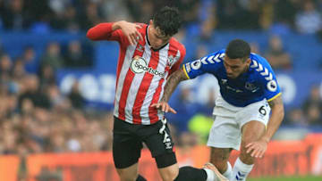 Everton's Brazilian midfielder Allan (R) vies with Southampton's English defender Tino Livramento during the English Premier League football match between Everton and Southampton at Goodison Park in Liverpool, north west England on August 14, 2021. - RESTRICTED TO EDITORIAL USE. No use with unauthorized audio, video, data, fixture lists, club/league logos or 'live' services. Online in-match use limited to 120 images. An additional 40 images may be used in extra time. No video emulation. Social media in-match use limited to 120 images. An additional 40 images may be used in extra time. No use in betting publications, games or single club/league/player publications. (Photo by Lindsey Parnaby / AFP) / RESTRICTED TO EDITORIAL USE. No use with unauthorized audio, video, data, fixture lists, club/league logos or 'live' services. Online in-match use limited to 120 images. An additional 40 images may be used in extra time. No video emulation. Social media in-match use limited to 120 images. An additional 40 images may be used in extra time. No use in betting publications, games or single club/league/player publications. / RESTRICTED TO EDITORIAL USE. No use with unauthorized audio, video, data, fixture lists, club/league logos or 'live' services. Online in-match use limited to 120 images. An additional 40 images may be used in extra time. No video emulation. Social media in-match use limited to 120 images. An additional 40 images may be used in extra time. No use in betting publications, games or single club/league/player publications. (Photo by LINDSEY PARNABY/AFP via Getty Images)