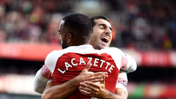 LONDON, ENGLAND - AUGUST 25: Alexandre Lacazette of Arsenal celebrates his team's second goal with Henrikh Mkhitaryan an own goal from Issa Diop of West Ham United (not pictured) during the Premier League match between Arsenal FC and West Ham United at Emirates Stadium on August 25, 2018 in London, United Kingdom. (Photo by Clive Mason/Getty Images)