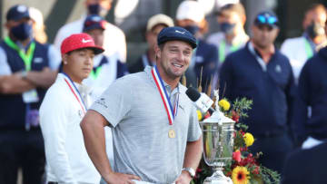 MAMARONECK, NEW YORK - SEPTEMBER 20: Champion Bryson DeChambeau (R) of the United States speaks during the trophy ceremony as low amateur John Pak (L) of the United States looks on during the 120th U.S. Open Championship on September 20, 2020 at Winged Foot Golf Club in Mamaroneck, New York. (Photo by Gregory Shamus/Getty Images)