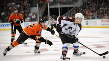 October 16, 2015; Anaheim, CA, USA; Colorado Avalanche right wing Mikko Rantanen (96) moves the puck ahead of Anaheim Ducks defenseman Josh Manson (42) during the third period at Honda Center. Mandatory Credit: Gary A. Vasquez-USA TODAY Sports