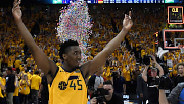 SALT LAKE CITY, UT - APRIL 27: Donovan Mitchell #45 of the Utah Jazz celebrates the Jazz win at the end of Game Six of Round One of the 2018 NBA Playoffs against the Oklahoma City Thunder at Vivint Smart Home Arena on April 27, 2018 in Salt Lake City, Utah. The Jazz beat the Thunder 96-91 to advance to the second round of the NBA Playoffs. NOTE TO USER: User expressly acknowledges and agrees that, by downloading and or using this photograph, User is consenting to the terms and conditions of the Getty Images License Agreement. (Photo by Gene Sweeney Jr./Getty Images)
