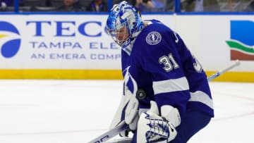 Sep 29, 2023; Tampa, Florida, USA; Tampa Bay Lightning goaltender Jonas Johansson (31) makes a save against the Carolina Hurricanes in the first period during preseason at Amalie Arena. Mandatory Credit: Nathan Ray Seebeck-USA TODAY Sports