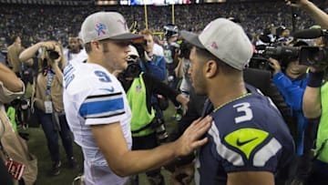 Oct 5, 2015; Seattle, WA, USA; Detroit Lions quarterback Matthew Stafford, (9) congratulates Seattle Seahawks quarterback Russell Wilson (3) after a game at CenturyLink Field. Seahawks won 13-10. Mandatory Credit: Troy Wayrynen-USA TODAY Sports