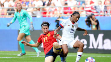 REIMS, FRANCE - JUNE 24: Lucía García of Spain tackles Crystal Dunn of the United States during the 2019 FIFA Women's World Cup France Round Of 16 match between Spain and USA at Stade Auguste Delaune on June 24, 2019 in Reims, France. (Photo by Maddie Meyer - FIFA/FIFA via Getty Images)