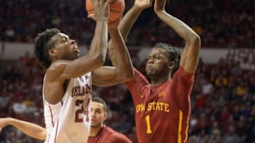 Jan 2, 2016; Norman, OK, USA; Oklahoma Sooners guard Buddy Hield (24) shoots the ball in front of Iowa State Cyclones forward Jameel McKay (1) during the second half at Lloyd Noble Center. Mandatory Credit: Mark D. Smith-USA TODAY Sports
